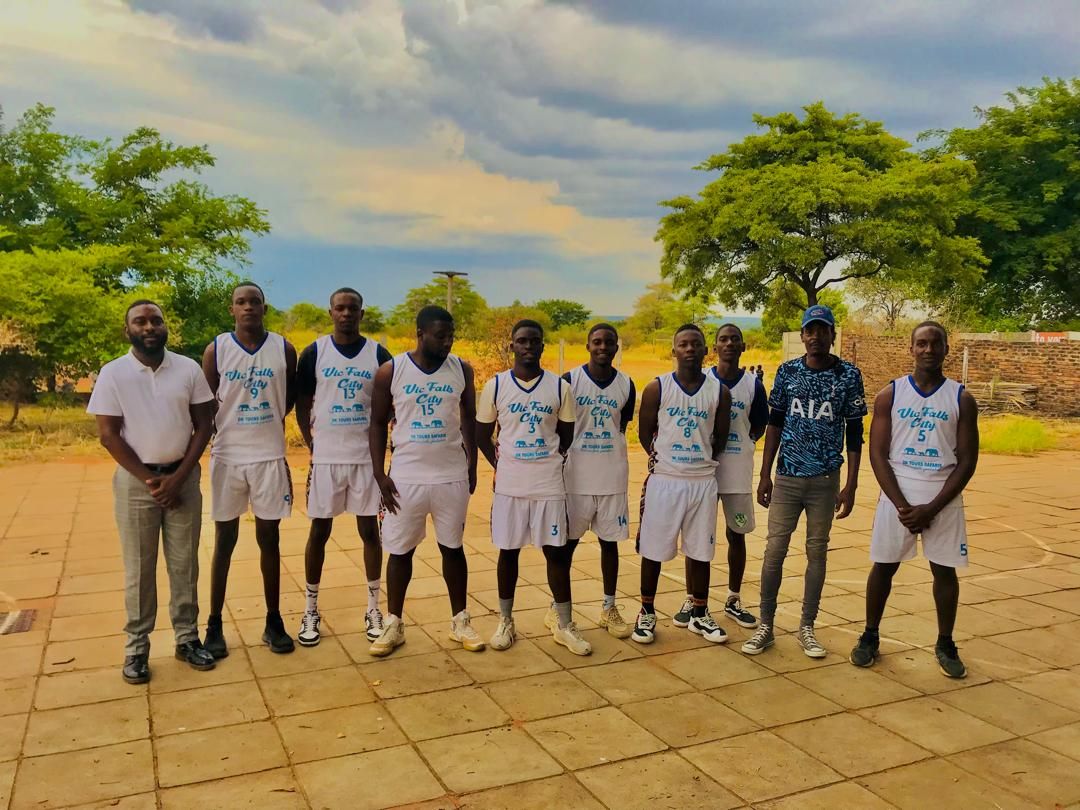 A Panthers squad lined up with their coach in kit carrying the DK Tours and Safaris sponsor mark