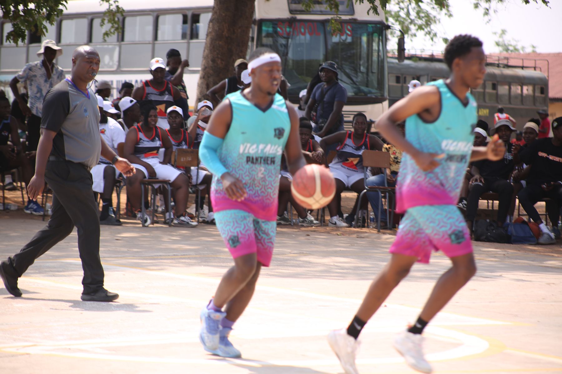 A junior league fixture in front of a courtside crowd